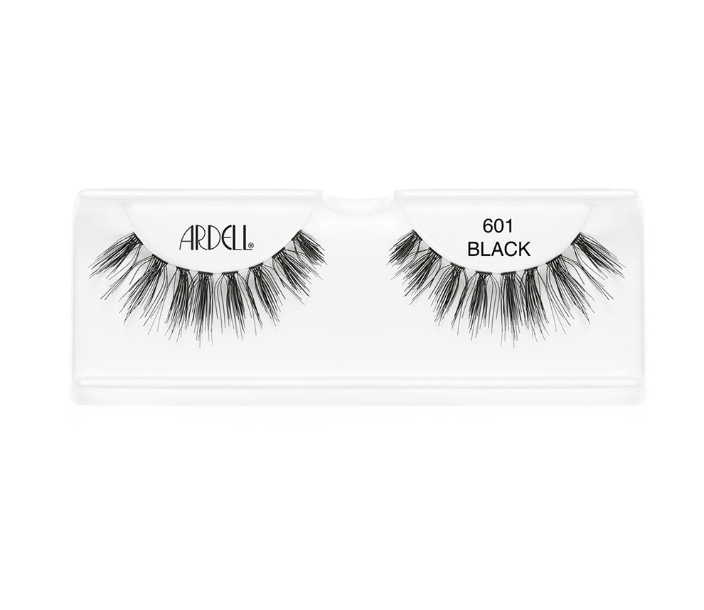 A pair of Ardell Wispies Clusters 601 placed on its inner container with some texts written on it