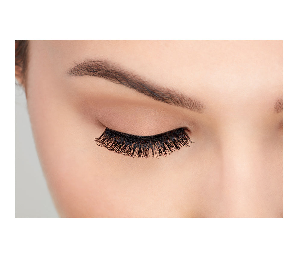 Close-up of a model's closed right eye wearing an Ardell Magnetic Double Lash 110 false lash.