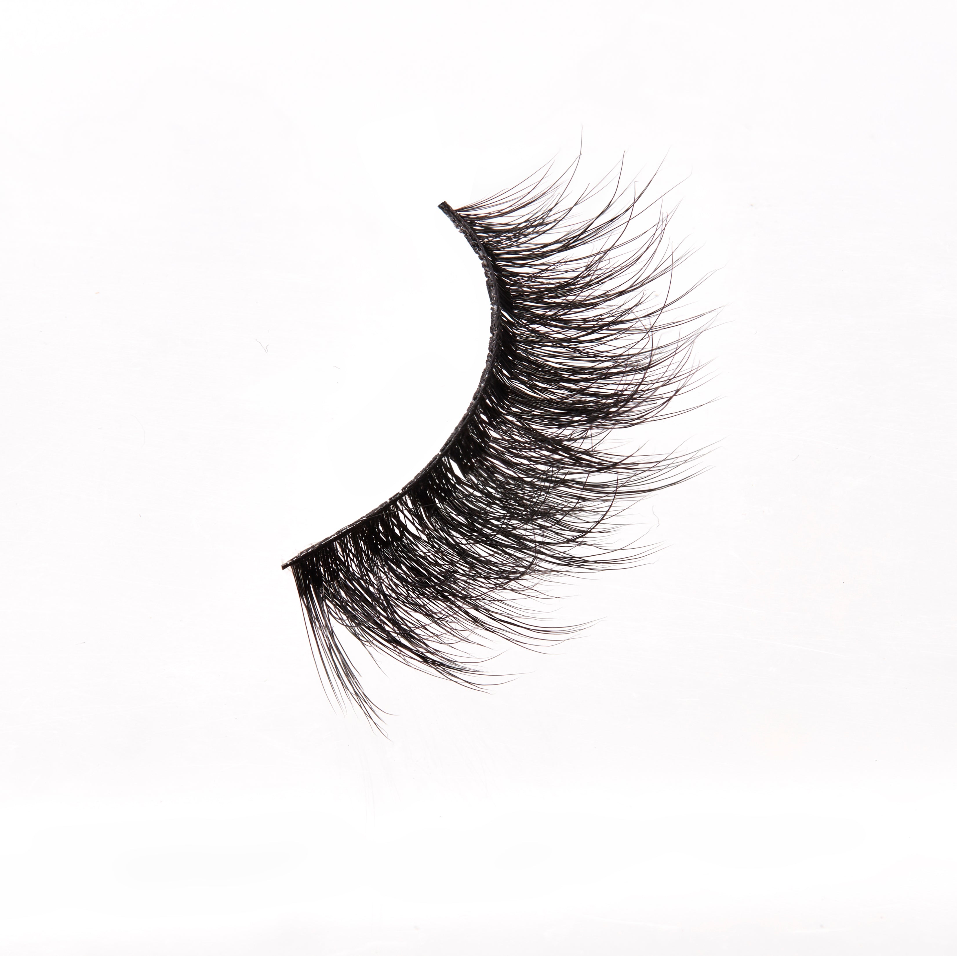 Pair of false eyelashes on a white background