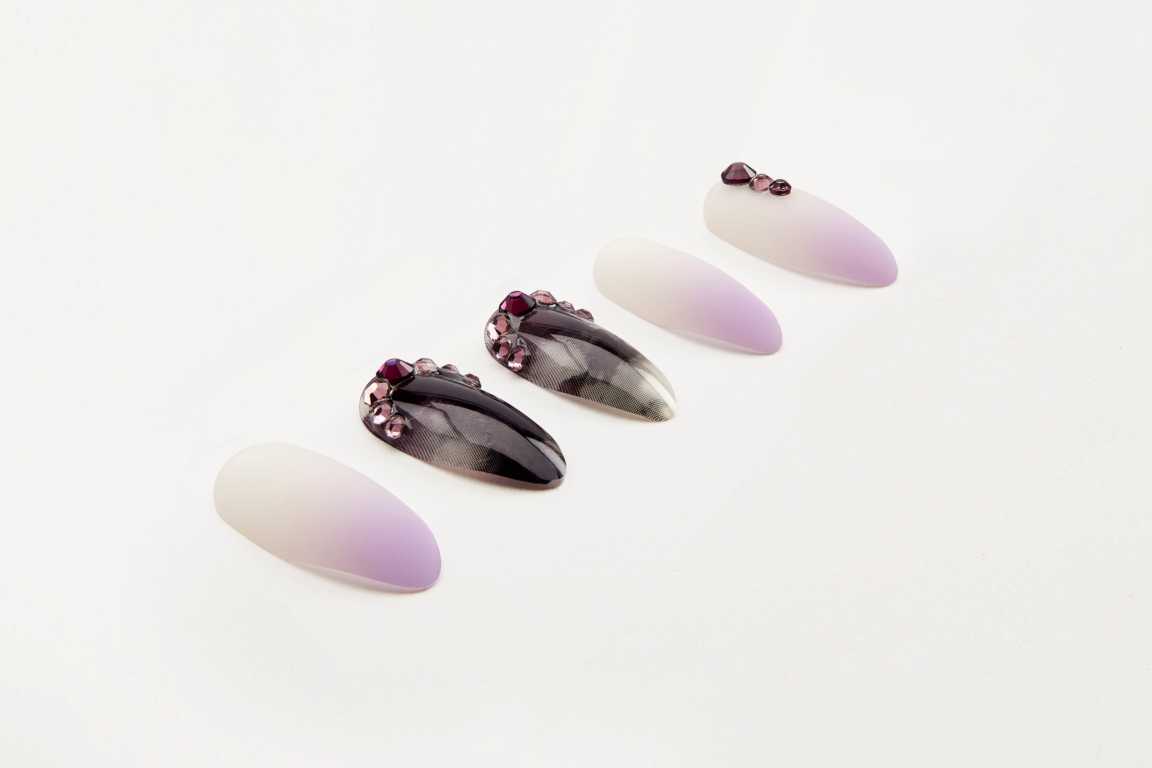 Ardell Nail Addict press-on nail set with ombre pink and glossy black gem designs for instant statement nails.