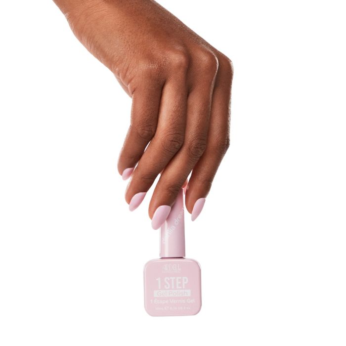 Model hand wearing Dahlia Dreams gel polish, a delicate light pink shade for a soft, feminine nail look.