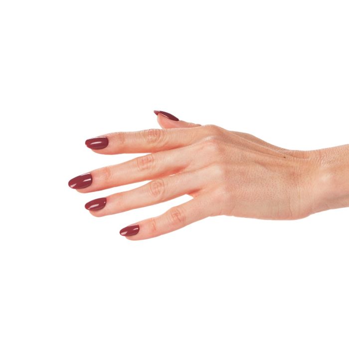 Extended hand displaying glossy mauve-burgundy gel nails in Ardell Refined for a refined, polished look.