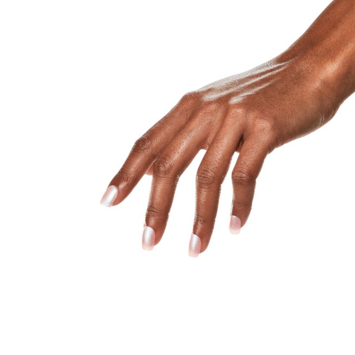 Hand modeling glossy shimmer pink nails using Ardell Lipgloss Glow gel polish for a radiant manicure look.