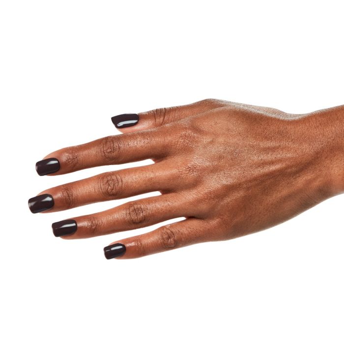 Hand pose with Ardell Rich Espresso polish, featuring a smooth and elegant dark gel shade on short nails.