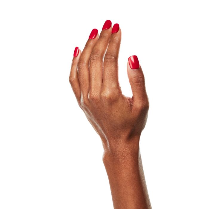 Natural hand pose wearing Ardell Venetian Red polish, a confident and sophisticated red gel color.