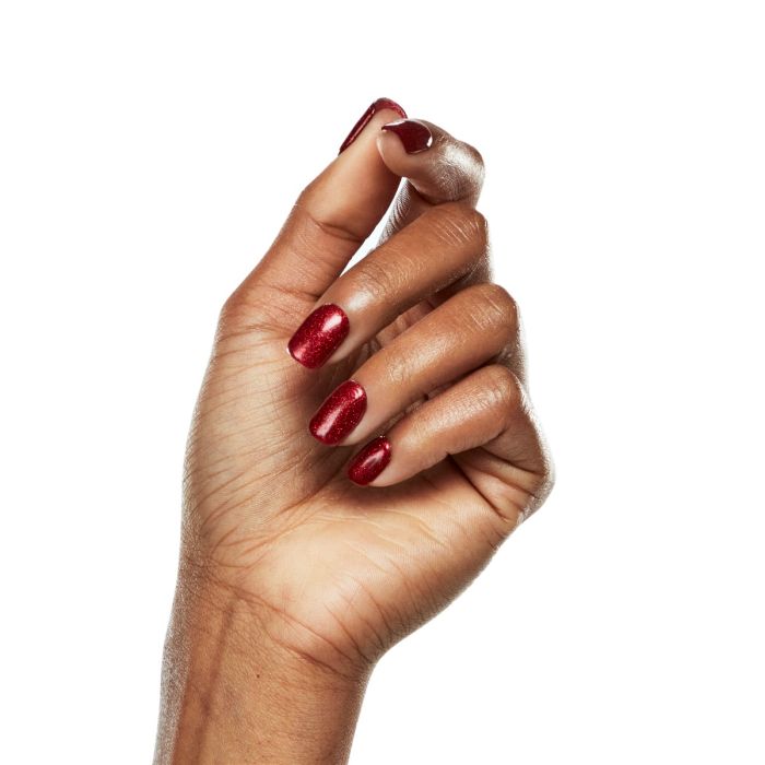 Natural hand pose with Ardell Lusty polish, highlighting its radiant cherry red metallic gel color.