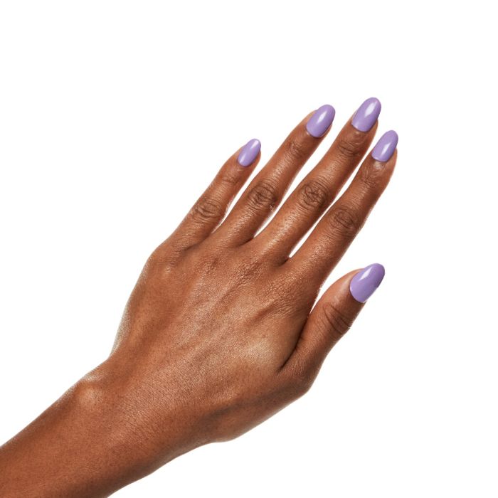 Natural hand pose with Ardell Harmony Haze polish, highlighting a subtle cool lavender manicure.