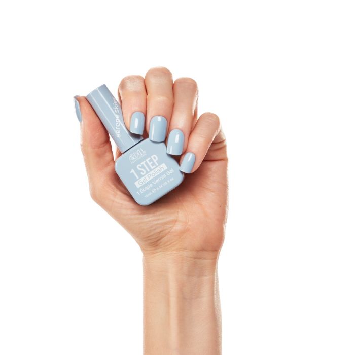 Hand model wearing Ardell Serene Skies gel polish, showcasing a soft and airy powder blue manicure.