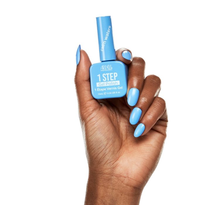 Hand shot with Ardell Calm Waters polish, highlighting a clean and calming blue nail look.