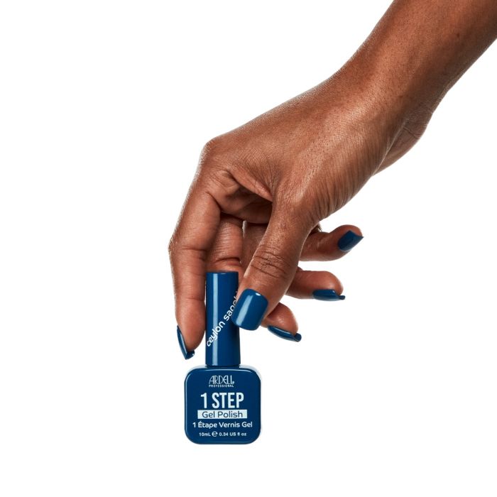 Hand shot with Ardell Ceylon Sapphire polish, highlighting a striking deep blue gel finish.