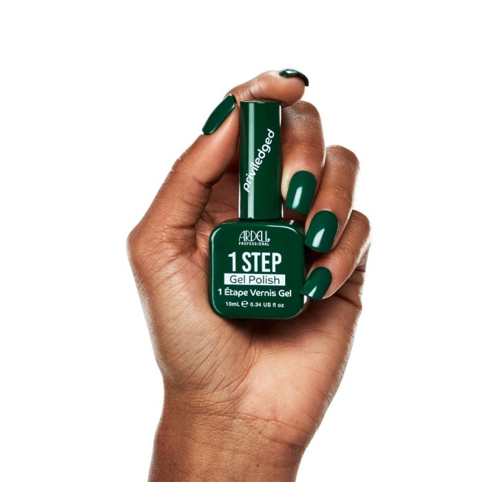 Glossy dark green manicure with Ardell Privileged gel polish on natural-length nails.