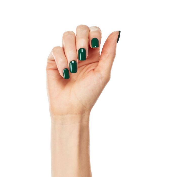 Natural hand shot with Ardell One Step Gel Polish in Privileged, a statement-making dark green shade.