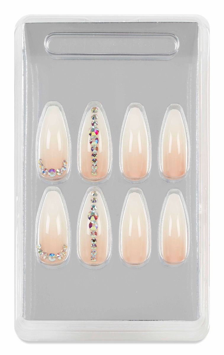 Boxed Ardell nude almond press-on nails with crystal embellishments for a chic, elegant manicure look.