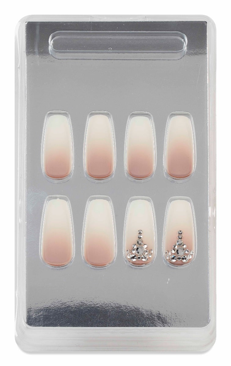 Ardell press-on nails in ombre nude with rhinestone embellishments shown in original storage tray.
