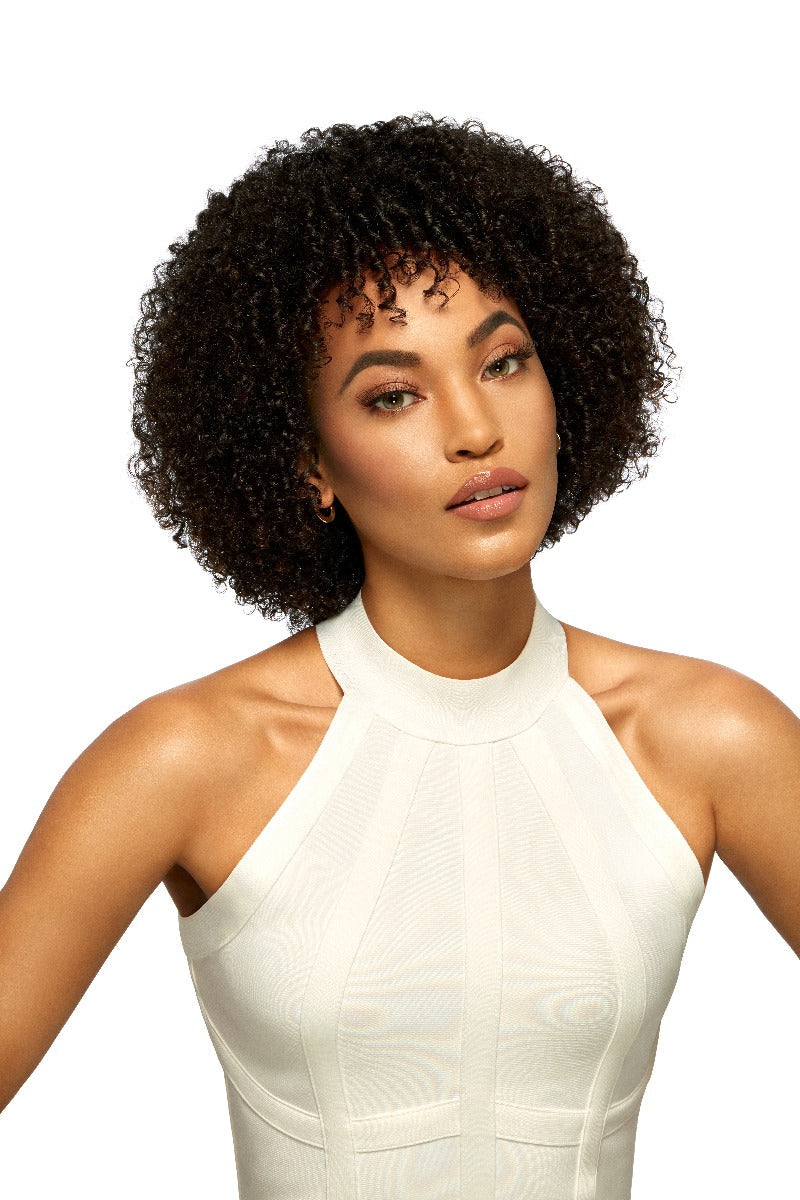 A beautiful woman in a white color outfit showing Ardell Lift Effect 744 faux lashes