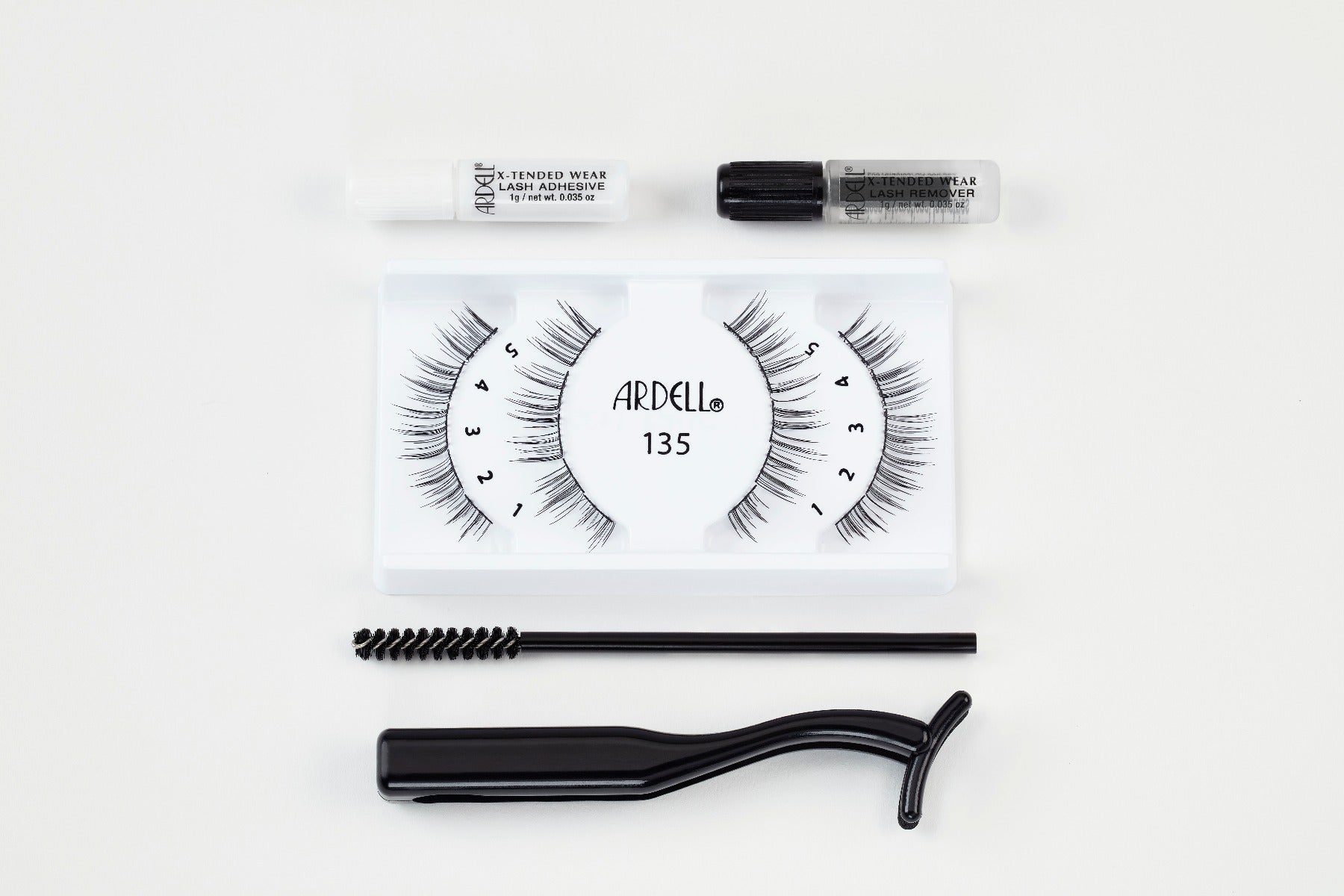 Ardell X-Tended Wear Lash Kit with 135 segments, adhesive, remover, spoolie, and applicator for seamless long wear.