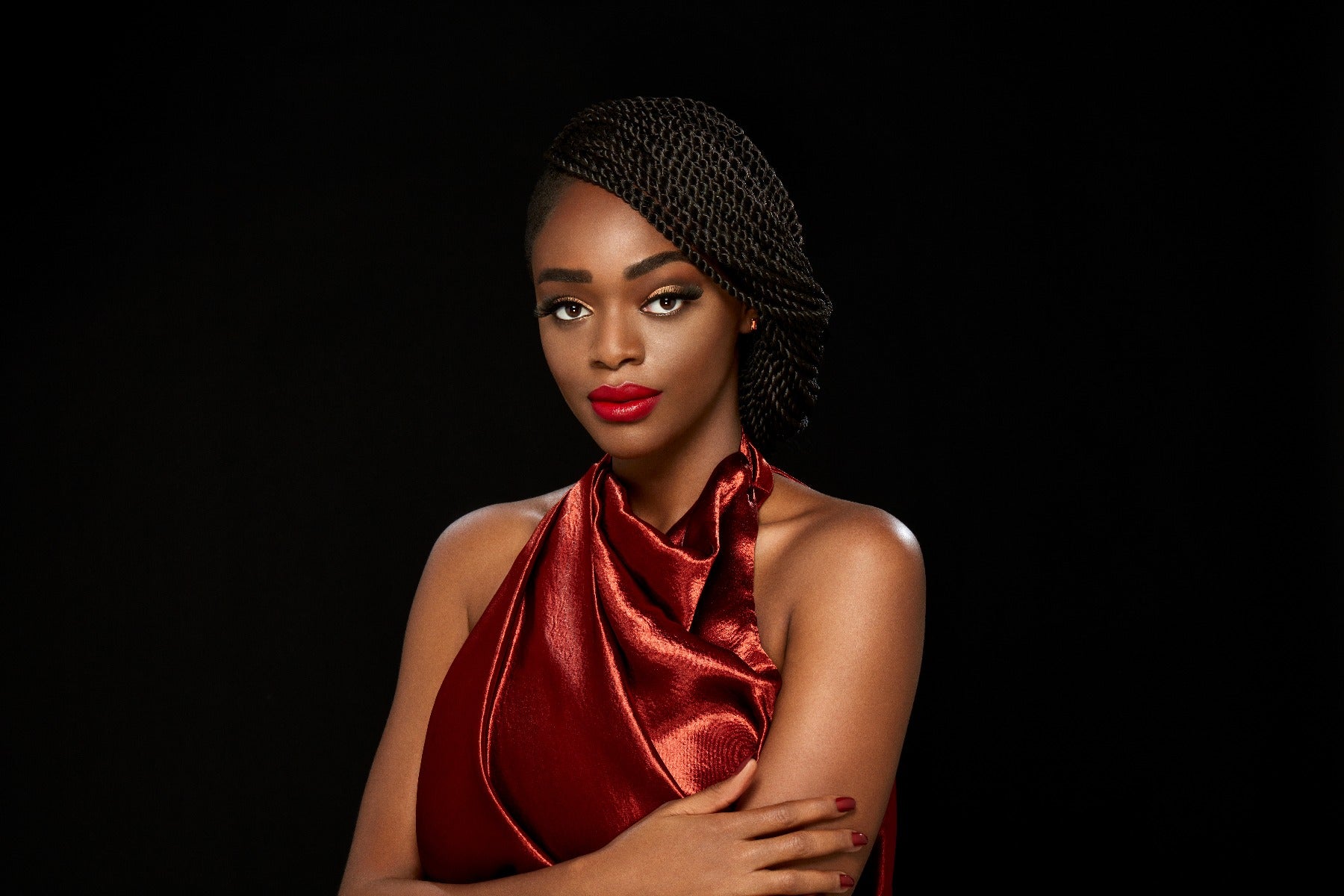 A model in a black background wearing a Russian inspired pair 8D Lashes