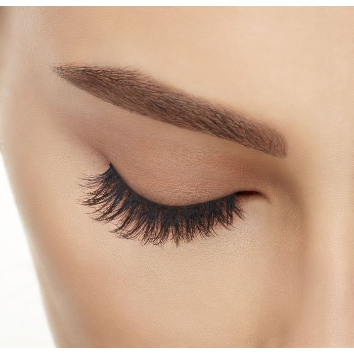Model with eyes closed wearing Ardell 3D Faux Mink 858 Lashes, showcasing curl and lightweight feel.