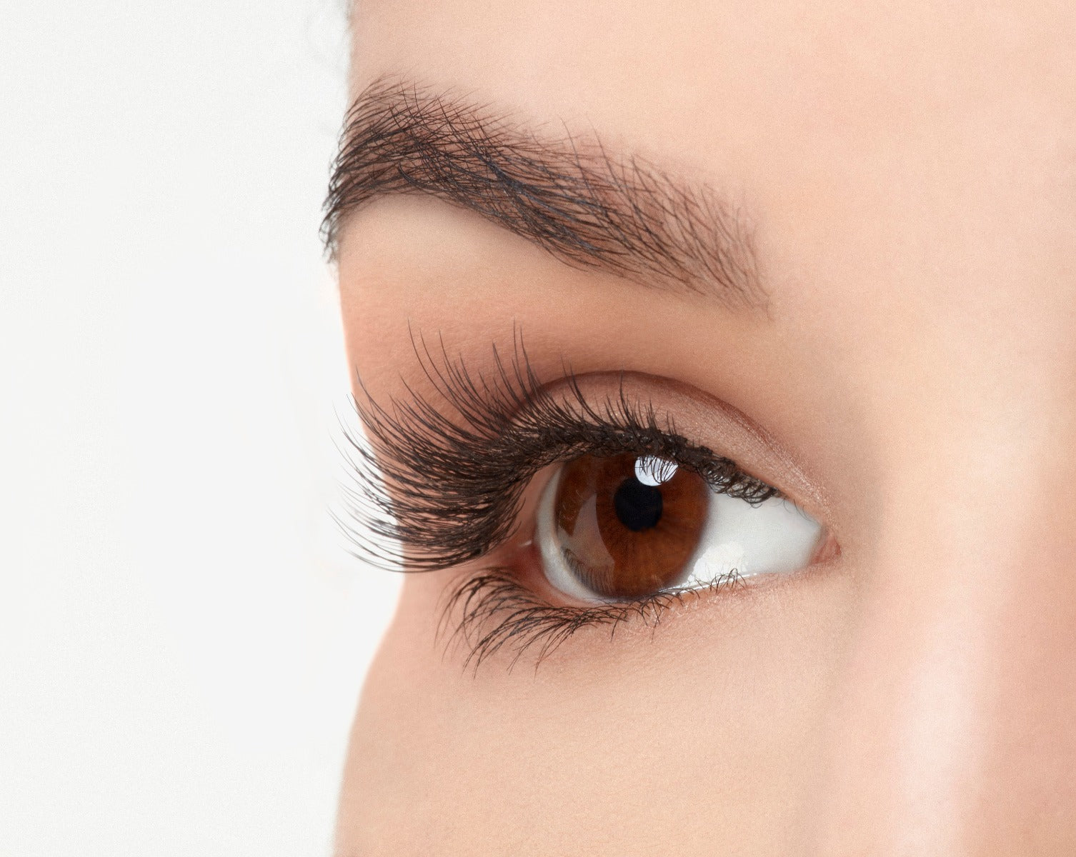 Angled right eye of a model wearing Ardell Pre-Cut Lashes 901 showing its curly and flares faux lash
