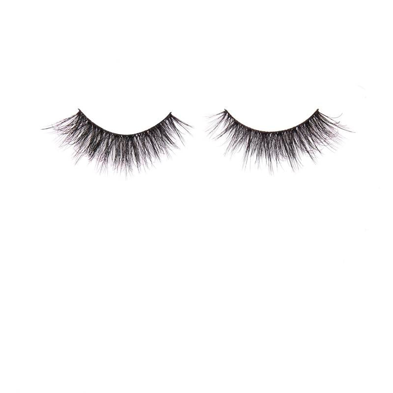Pair of black false eyelashes on a white background
