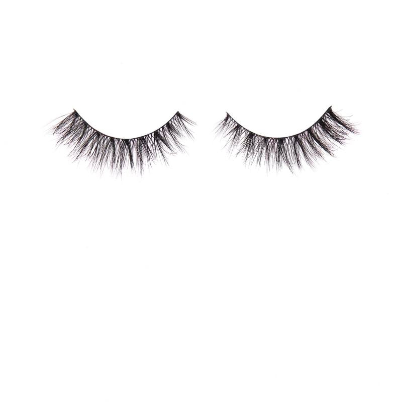 Pair of false eyelashes on a white background