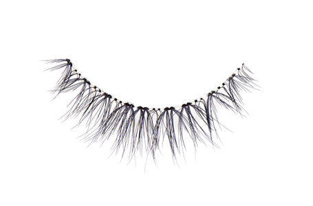 Close-up of an Ardell Natural 172 false lash for the right eye featuring clustered lash fibers
