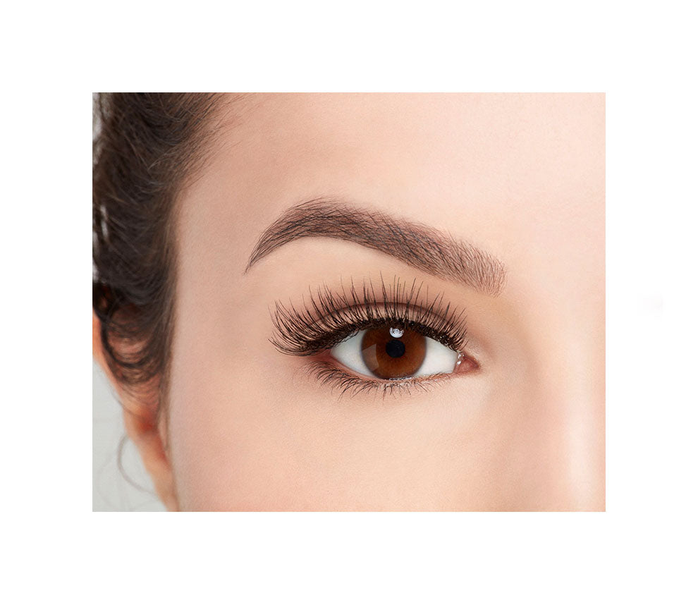Close-up of a model's open right eye wearing an Ardell Remy Lash 781 false lash