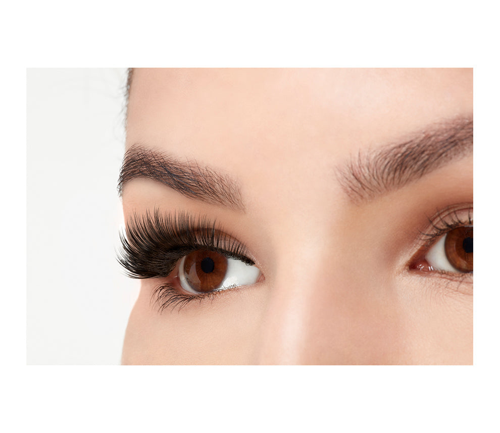 A model wearing  Ardell 3D Faux Mink 854 in side view emphasizing the curly, flared & natural lash look