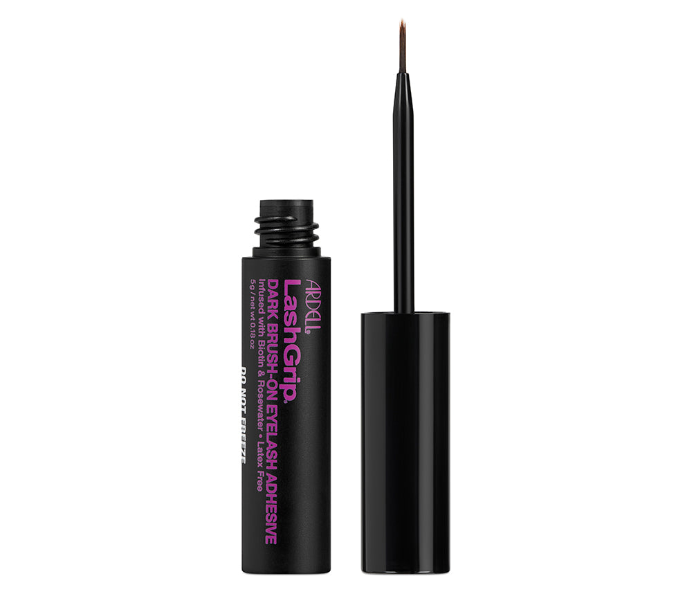 Uncapped bottle of Ardell LashGrip Brush-On Lash Adhesive Infused with Biotin & Rosewater cap with brush standing to its left