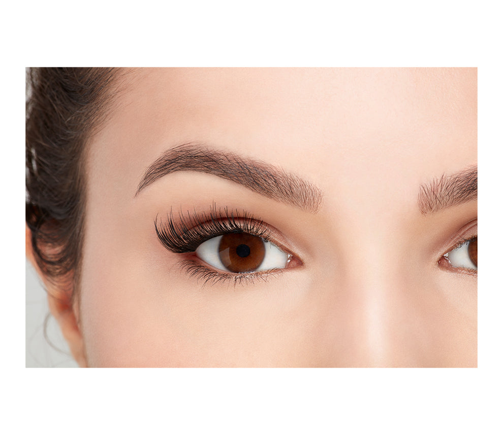Close-up of a model's open right eye wearing an Ardell Magnetic Accent 001 faux lash.
