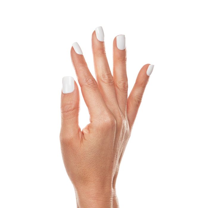 Close-up of White Coral polish application for a bold white gel nail look with smooth shine.
