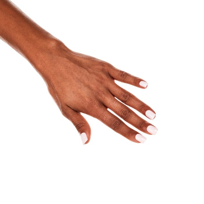 Model showcasing Ardell Flower Petal on natural nails, featuring a pale pink gel polish with a polished, glossy shine.