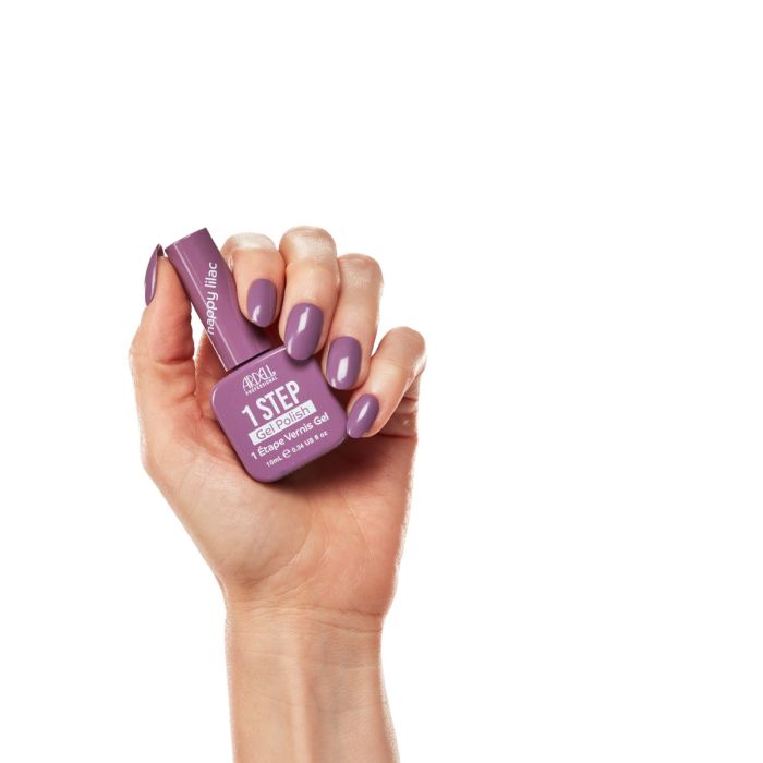 Hand model wearing Ardell Happy Lilac polish, showcasing a soft, creamy lilac manicure with a warm pink hue.