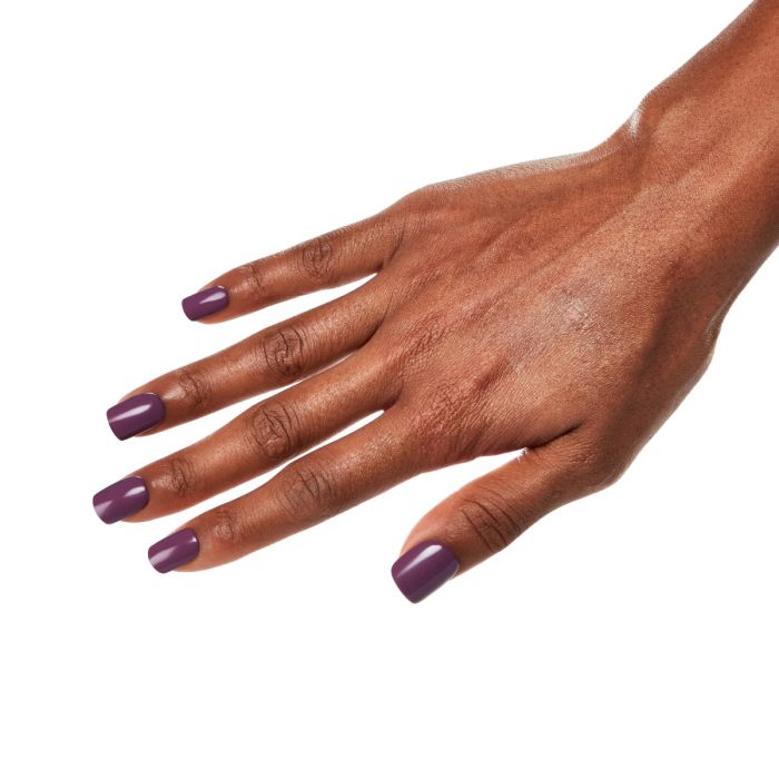 Side hand pose in Ardell Plump Plum polish, highlighting the creamy and saturated plum tone.