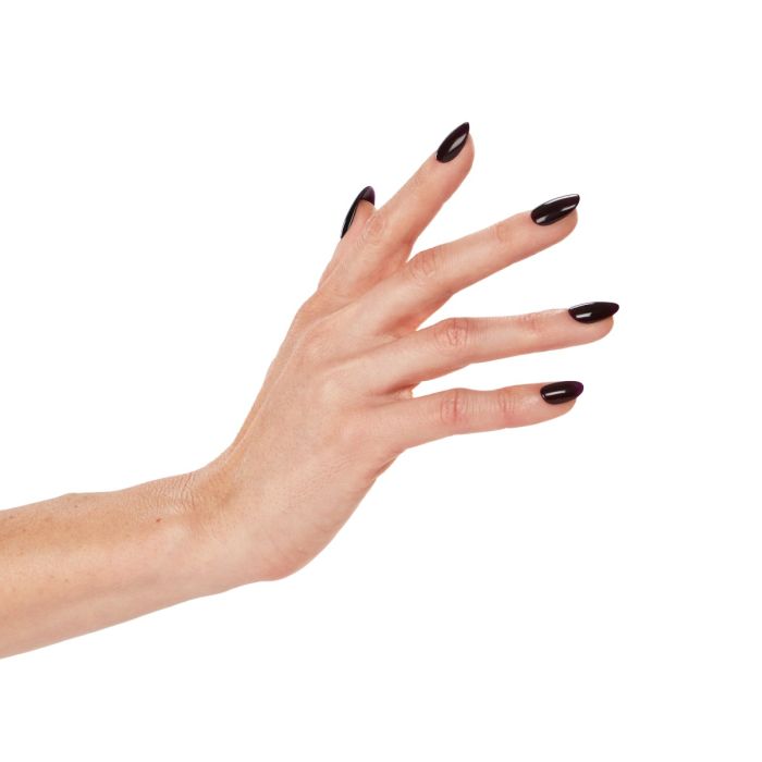 Close-up of hand in Ardell Mystifying polish, highlighting its luxe burgundy tone with a smooth gel finish.