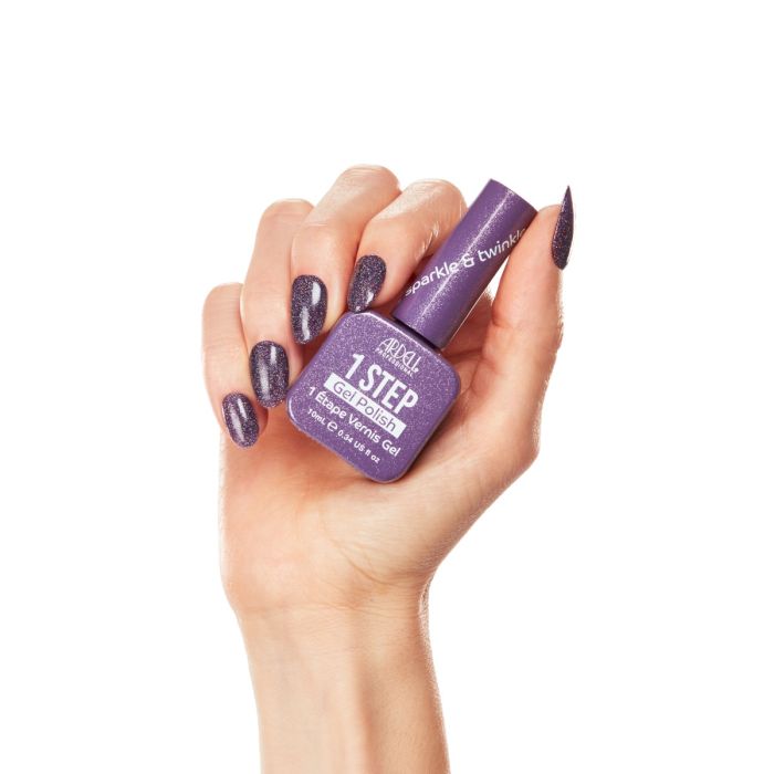 Hand model wearing Ardell Sparkle & Twinkle gel polish, featuring a shimmering violet glitter manicure.