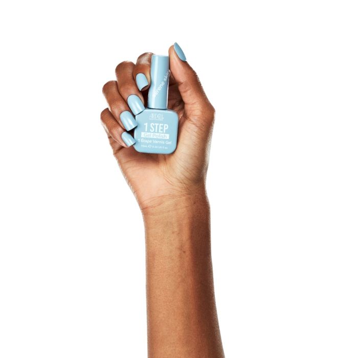 Model hand shot with Ardell Serene Skies polish, featuring a clean, soft blue nail look.
