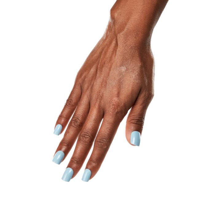 Natural hand pose wearing Ardell Serene Skies polish, highlighting its subtle powder blue elegance.