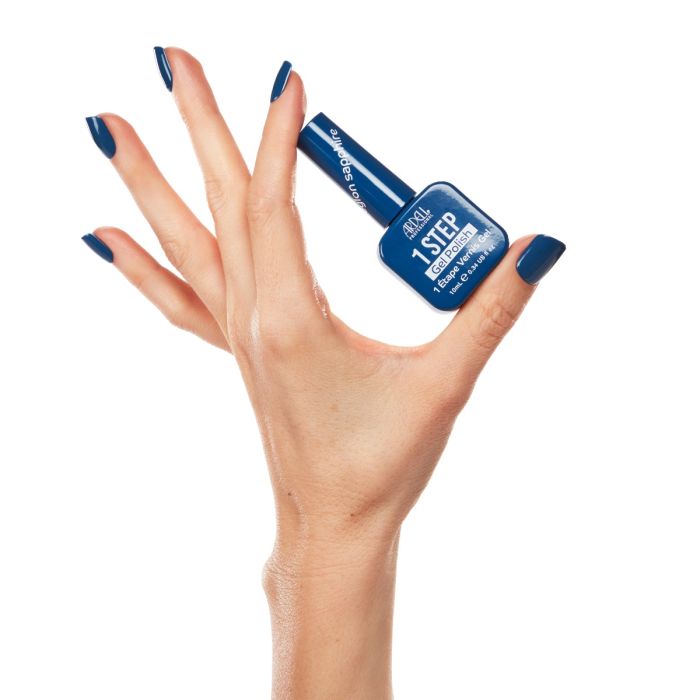 Model hand wearing Ardell Ceylon Sapphire gel polish, featuring a rich and bold blue manicure.