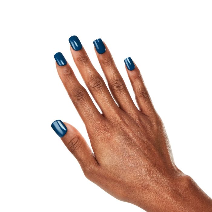 Model shot with Ardell Ceylon Sapphire polish, showcasing a glossy, high-impact sapphire blue manicure.