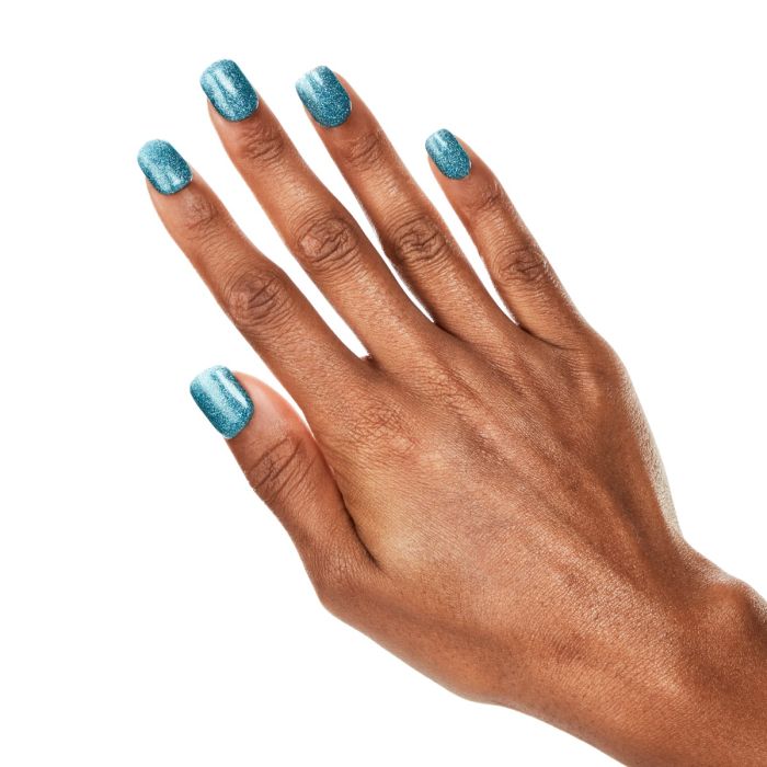Detailed hand image featuring Ardell Catching Waves gel polish, a bold turquoise with a glimmering finish.