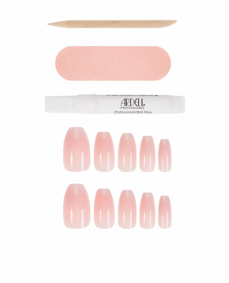 Glossy pink nude coffin press-on nails with nail glue and file for a salon-style manicure.