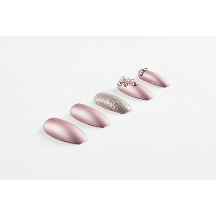 Close-up of Ardell Nail Addict Premium metallic lilac pearl nails with matte, glitter, and embellished finishes.