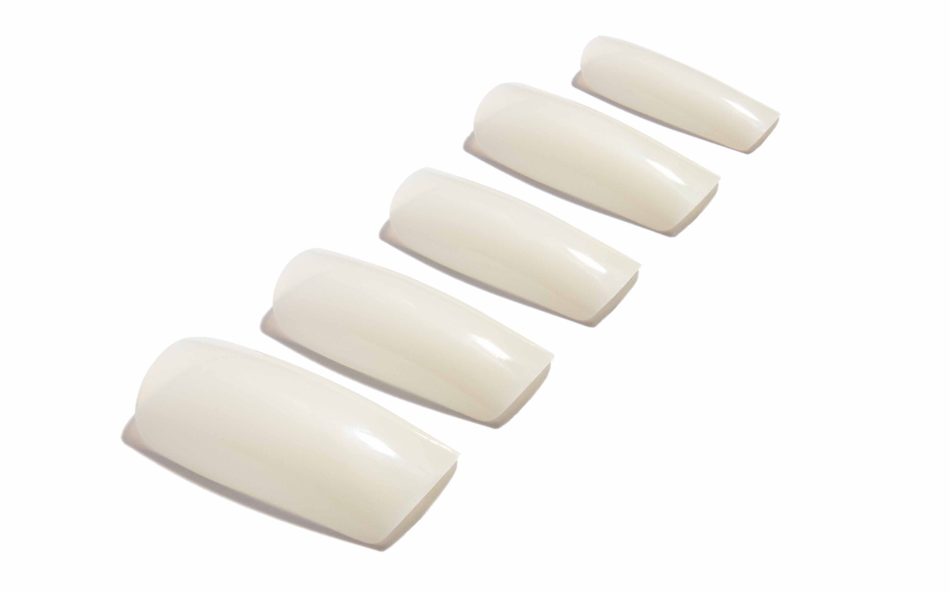 Set of Ardell Nail Addict Natural Square Long Multipack lay in a 45-degree angle position