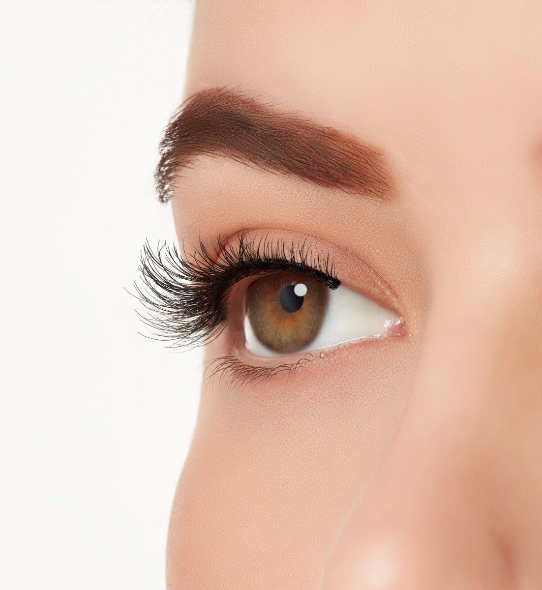 An extreme side close up shot of a model's eye wearing Ardell's Ecolashes 451 creating natural, round flared eyelash