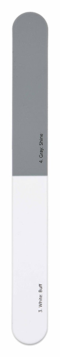 Ardell double-sided nail buffer with labeled gray shine and white buff sections for smooth nail finishing.