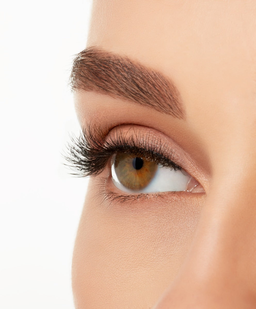 A side shot of a model's eye wearing Ardell's Magnetic Lash 421, with lash visually seen with a longer length in the center