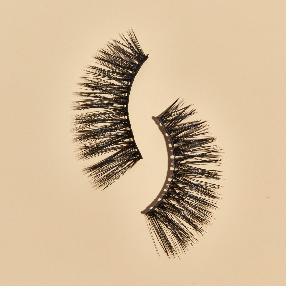 1 pair of lashes on a creme background 