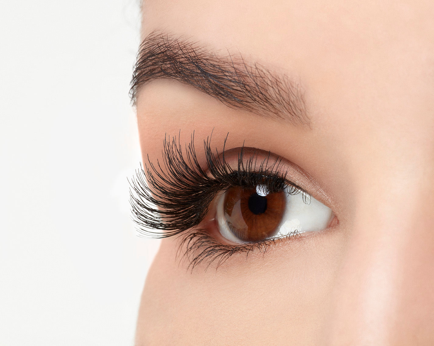 A model wearing Ardell Studio Effects Wispies showing its enhanced winged effect and the undetectable lash band