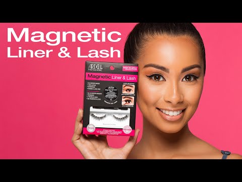 Smiling model holding Ardell Magnetic Liner & Lash kit with pink background.